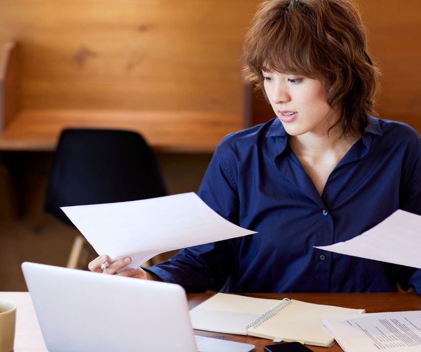 Business owner reviewing a merchant cash advance lawsuit summons before contacting an MCA debt attorney