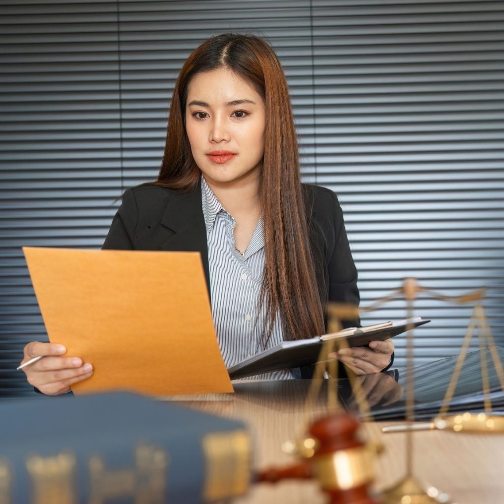 Attorney reviewing merchant cash advance lawsuit documents and preparing a response