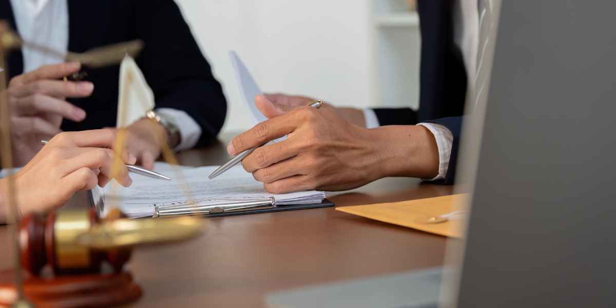 Merchant cash advance lawsuit summons and legal paperwork on a desk