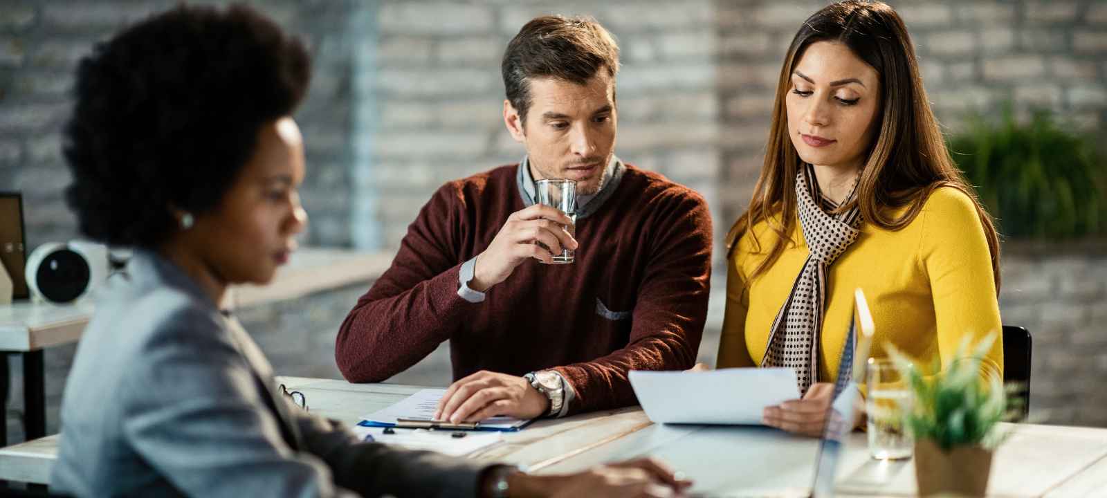 Business owner working through vetting questions with an advisor before signing an MCA settlement agreement