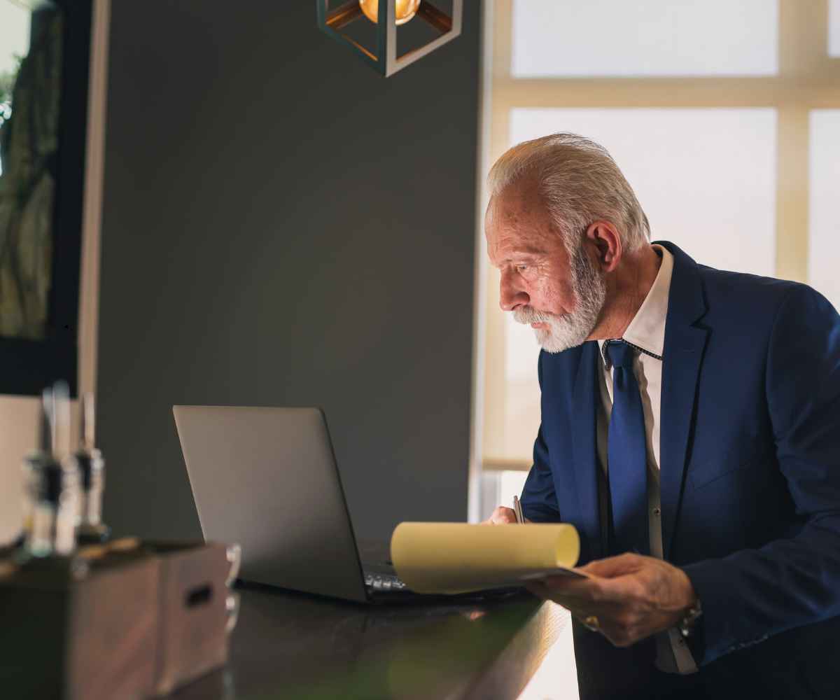 Business owner reading Debt Consultants Group reviews before choosing an MCA debt program