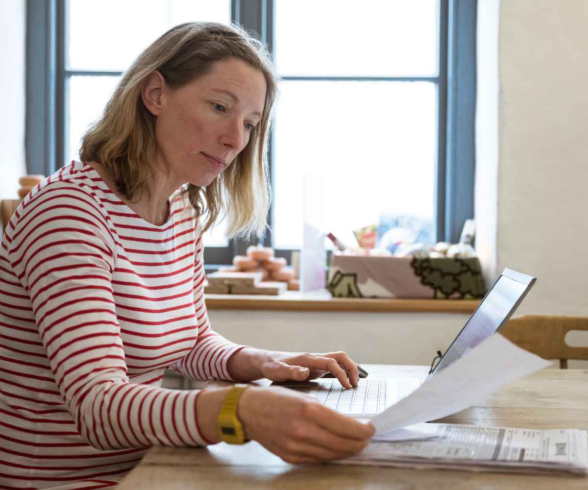 Business owner researching whether a merchant cash advance is a scam