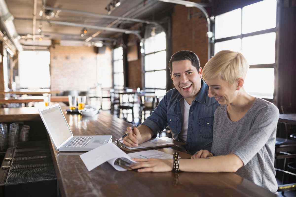 Business owner working through the questions to ask a business debt company before signing