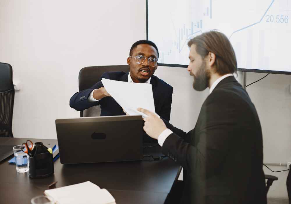Business owner and advisor reviewing how a business debt program works