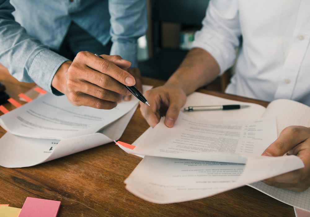 Business owner working through a checklist of questions before signing with an MCA debt company